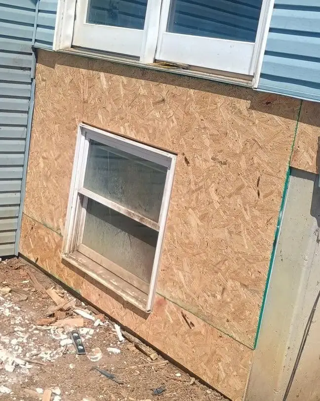 Siding repair in progress on a Kansas City home